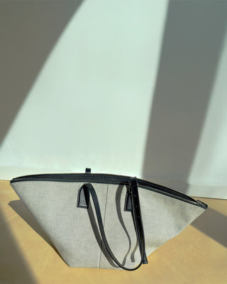 Black mesh strainer on a light background