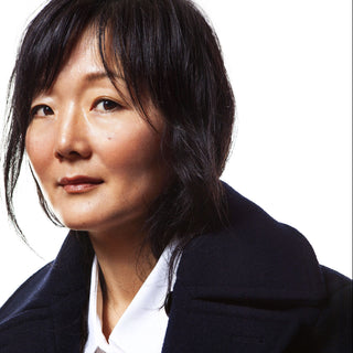 Designer Jennifer Lyu wearing navy coat