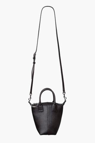 A black concierge tote bag with stamped leather, a long shoulder strap, and a sleek design.